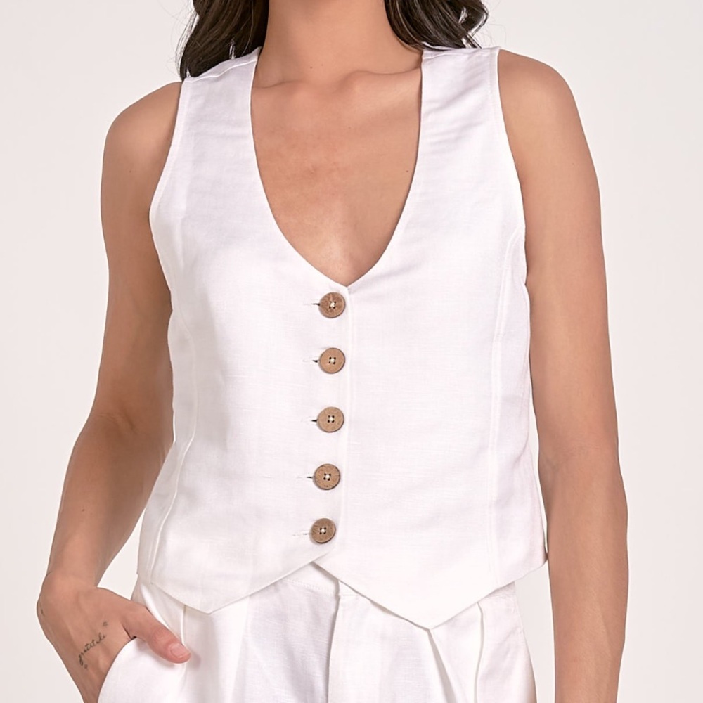 New with tags. White vest. Gorgeous buttons and fabric. Elan. Multiple sizes